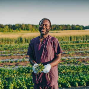 Nathaniel holding herbs