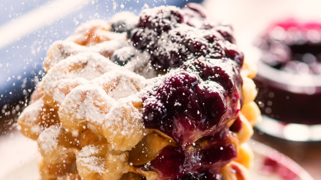 blueberry compote on stack of small waffles