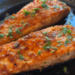 honey soy-glazed salmon in a pan