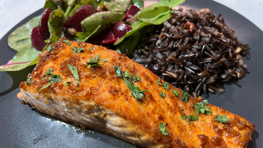 salmon served with wild rice and beet salad