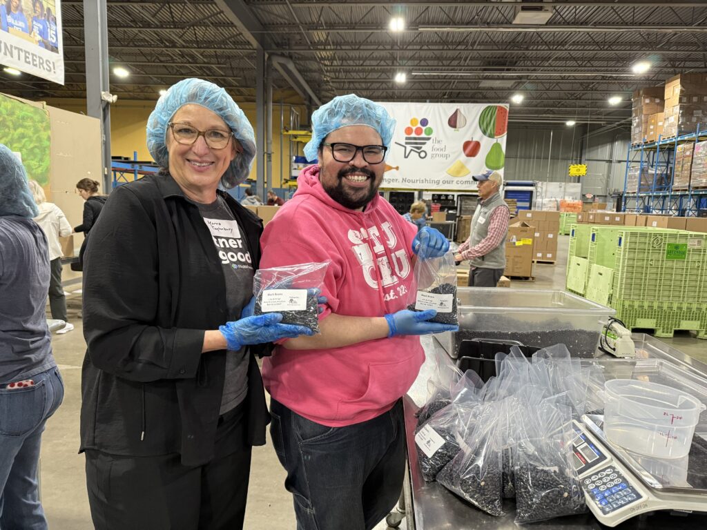 Marna volunteering (on left) with colleague.