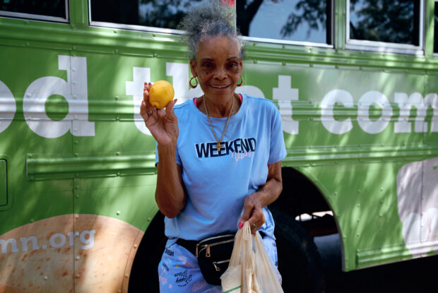 Participant with their selection of fresh groceries.