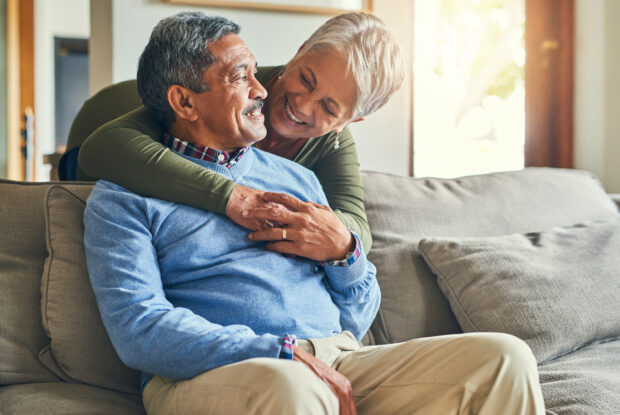 Happy, hugging senior couple. A legacy gift supports your future.