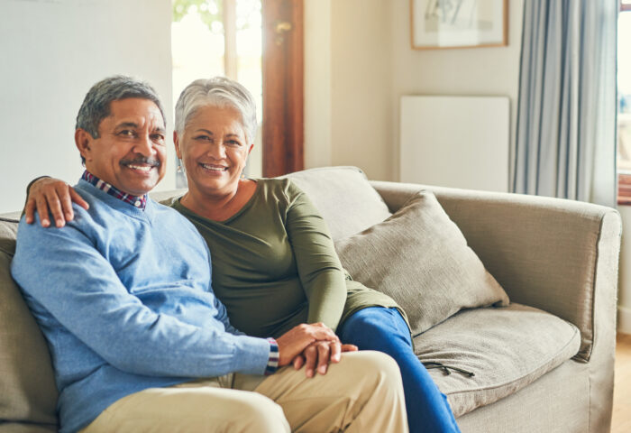 Planned legacy. Senior woman, happy man and love in living room for commitment, comfort and milestone.