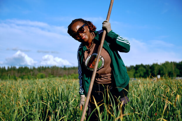 Farmer stands with shovel at Big River Farms