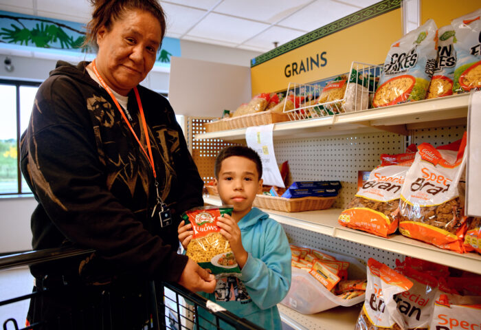 Mom and son at food shelf.