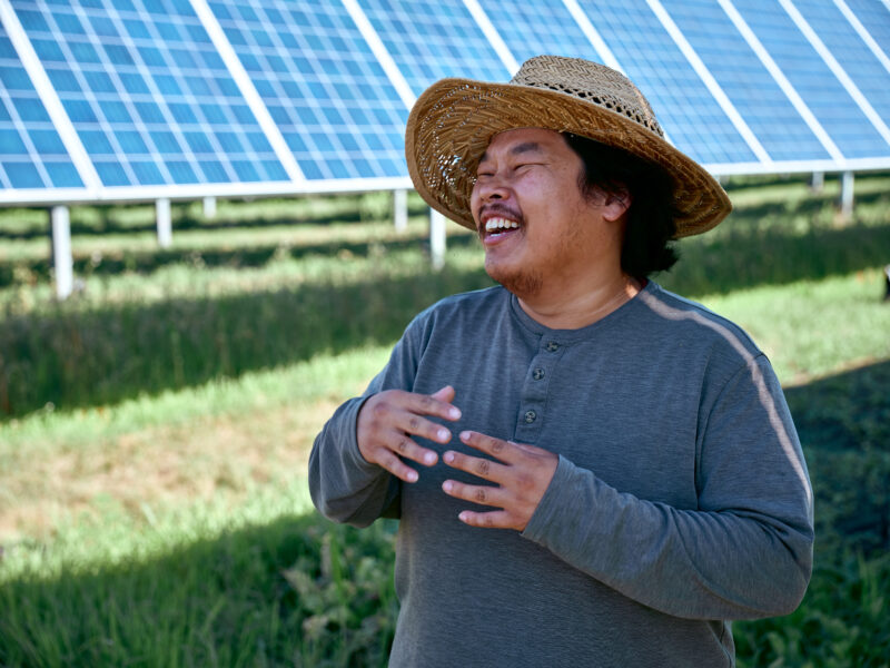 Farmer talks in front of solar array at our AgriSolar Farm