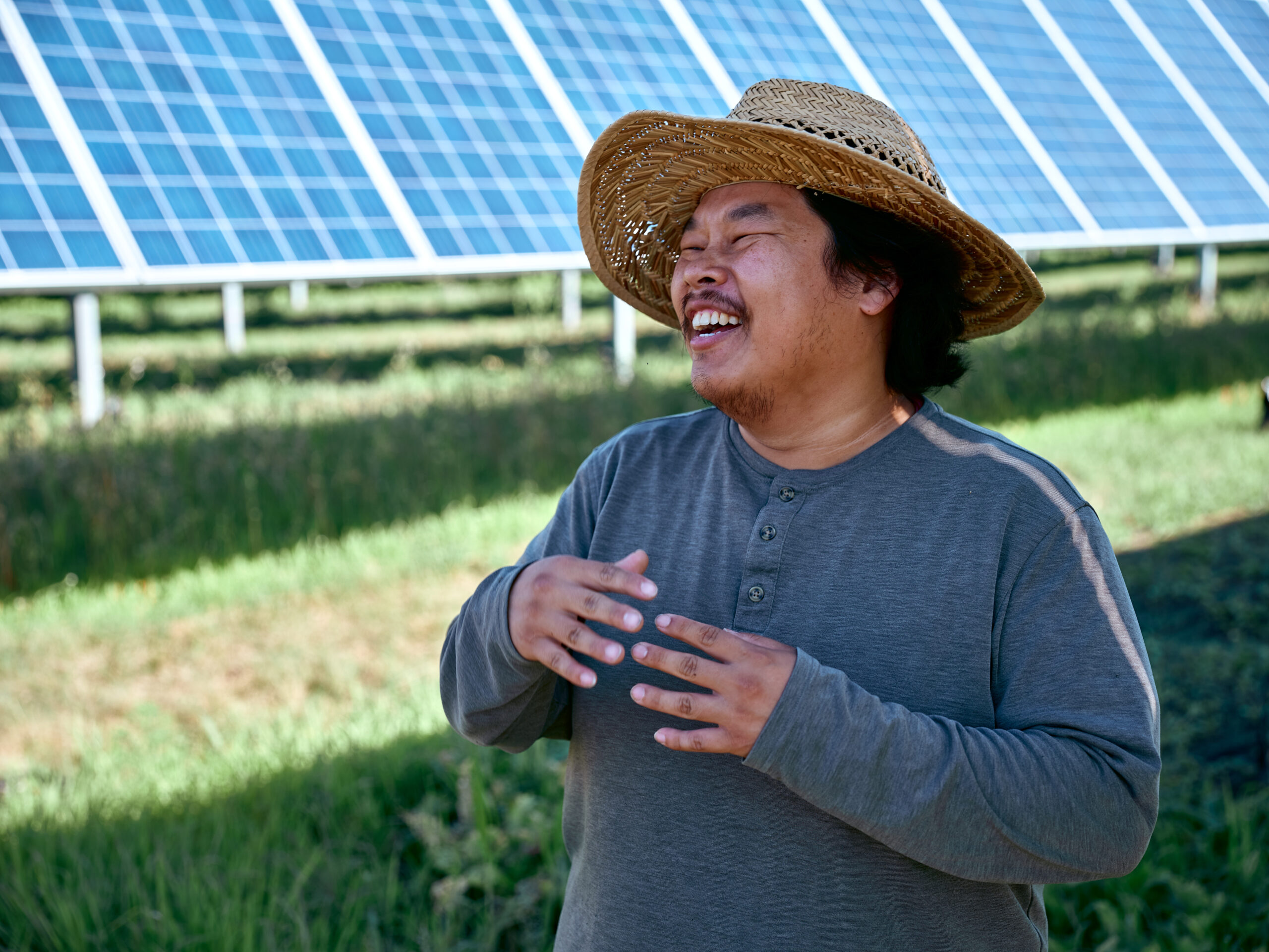 Farmer talks in front of solar array at our AgriSolar Farm