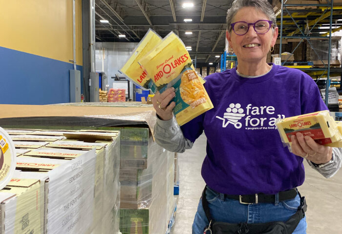 Land O' Lakes donation to The Food Group. Staff holding donated products.